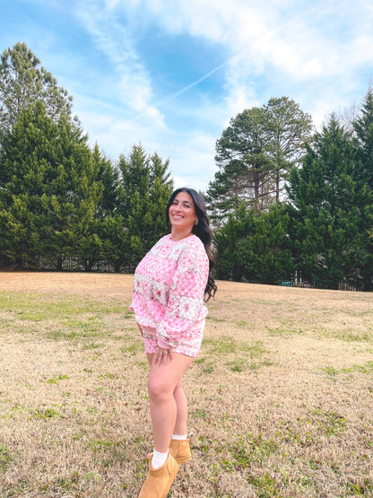 Pink floral quilted loungewear set for women, featuring a cozy sweatshirt and shorts, perfect for casual outings.