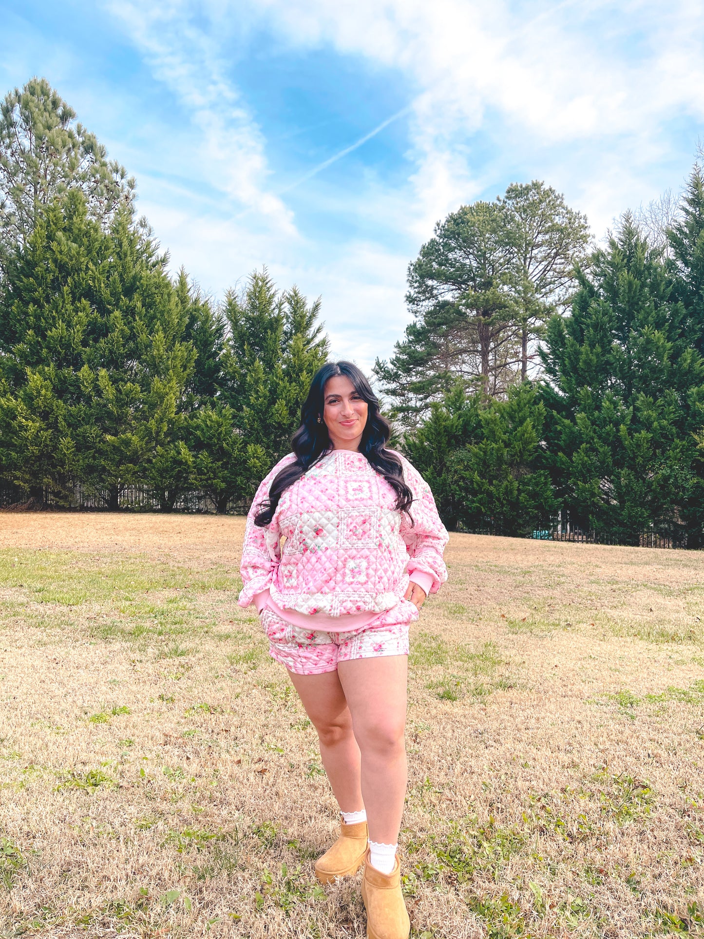 Cozy pink quilted loungewear set featuring a hoodie and shorts, perfect for casual outdoor wear.